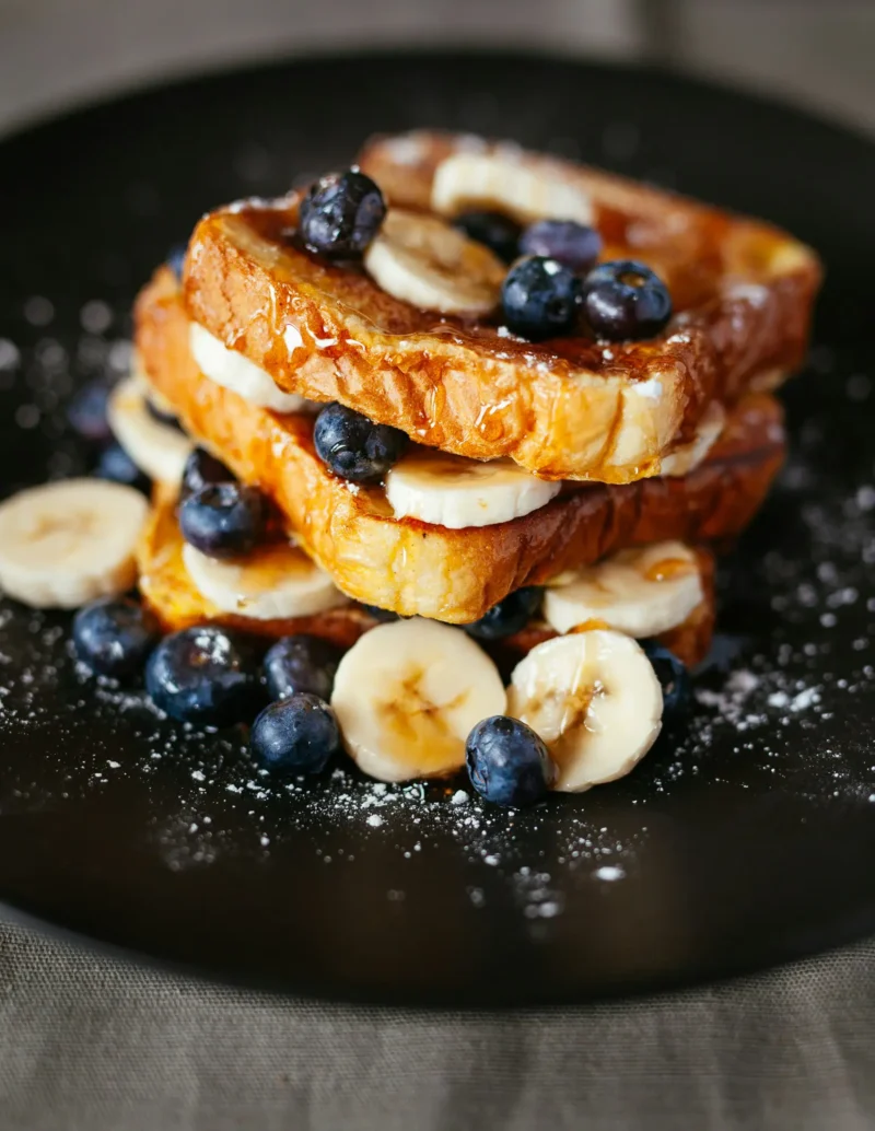 Stack of French toast slices drizzled with syrup at brunch