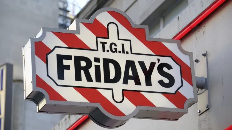 Classic red and white striped TGI Fridays exterior sign. Representing the hospitality roots and flair bartending beginnings of Bar Rescue Co-Host Phil Wills.
