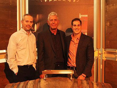 Anthony Bourdain standing between two men, including Art Sutley on the right, at a Balvenie event