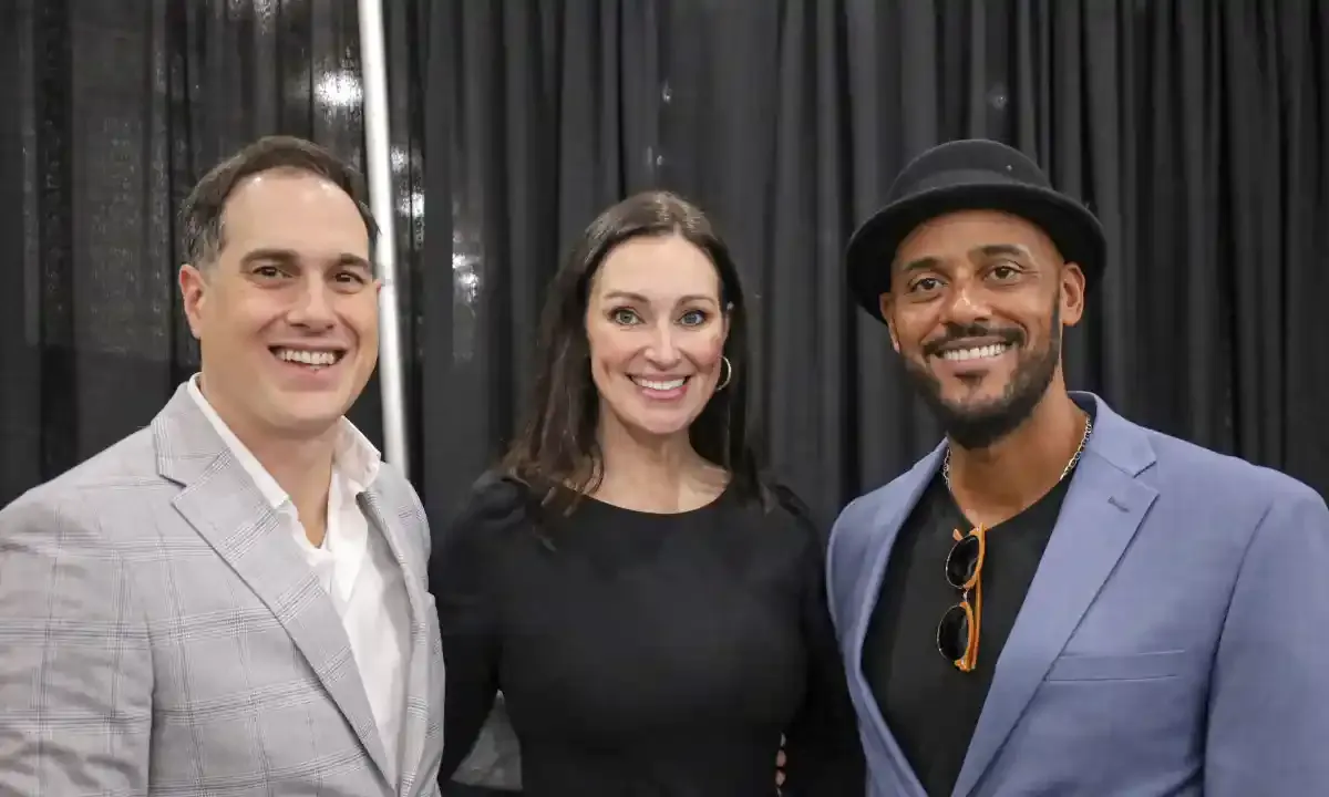 The Super Squad: Art Sutley, Mia Mastroianni, and Phil Wills posing together at the Bar & Restaurant Expo