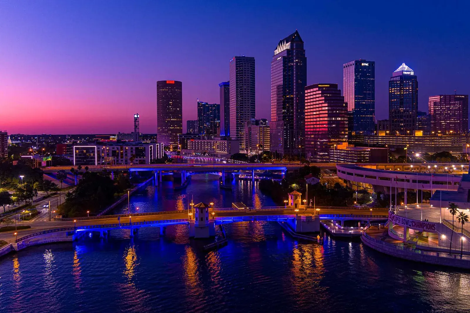 Downtown Tampa skyline and the lit bridges over the Hillsborough River at dusk